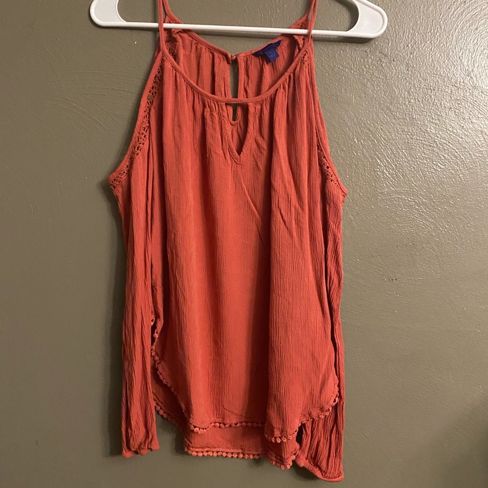 Woman’s orange off the shoulder top